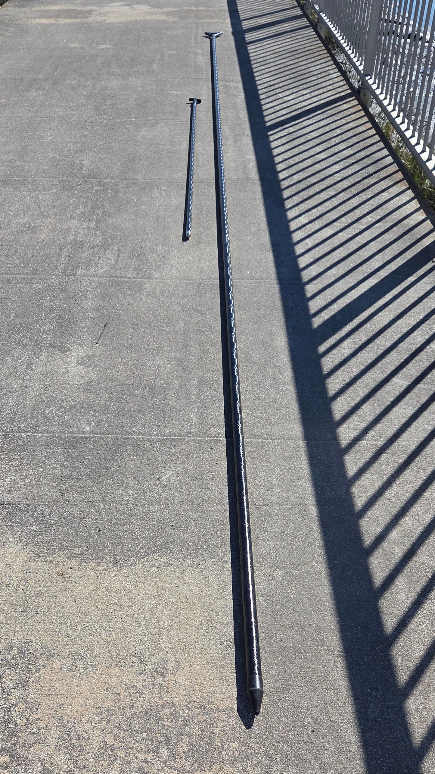 Filament wound carbon fiber push pole on a dock